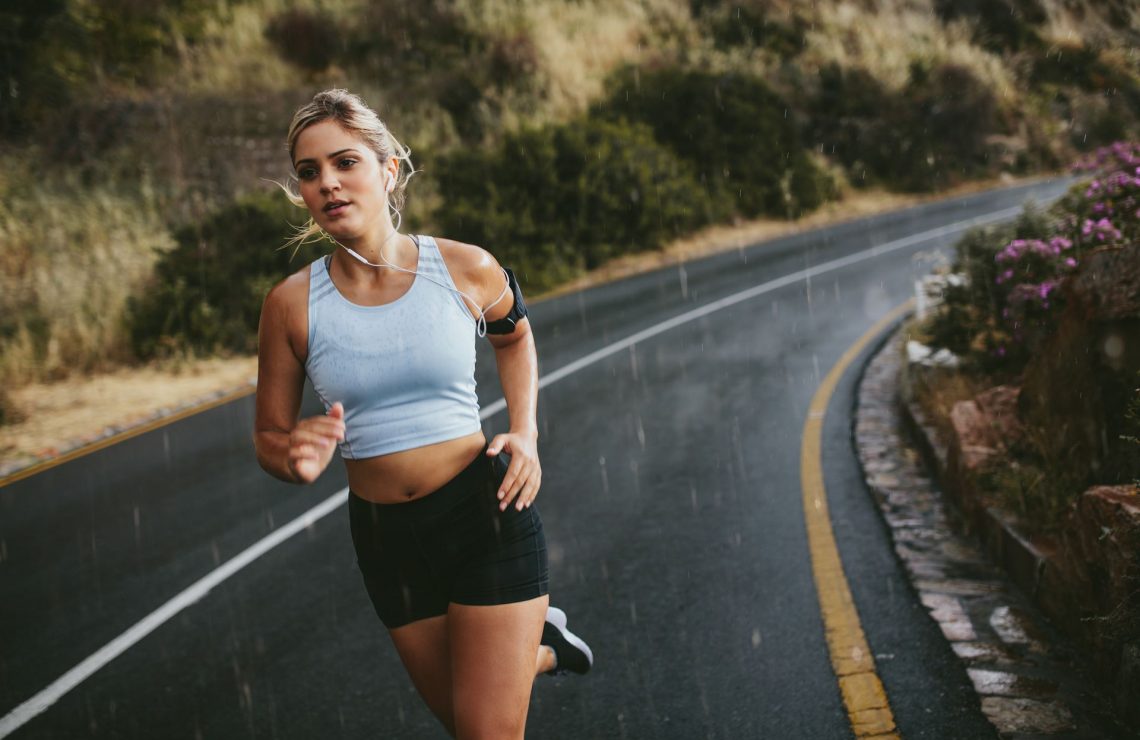 fit-young-woman-running-on-highway-P3EQUN8.jpg